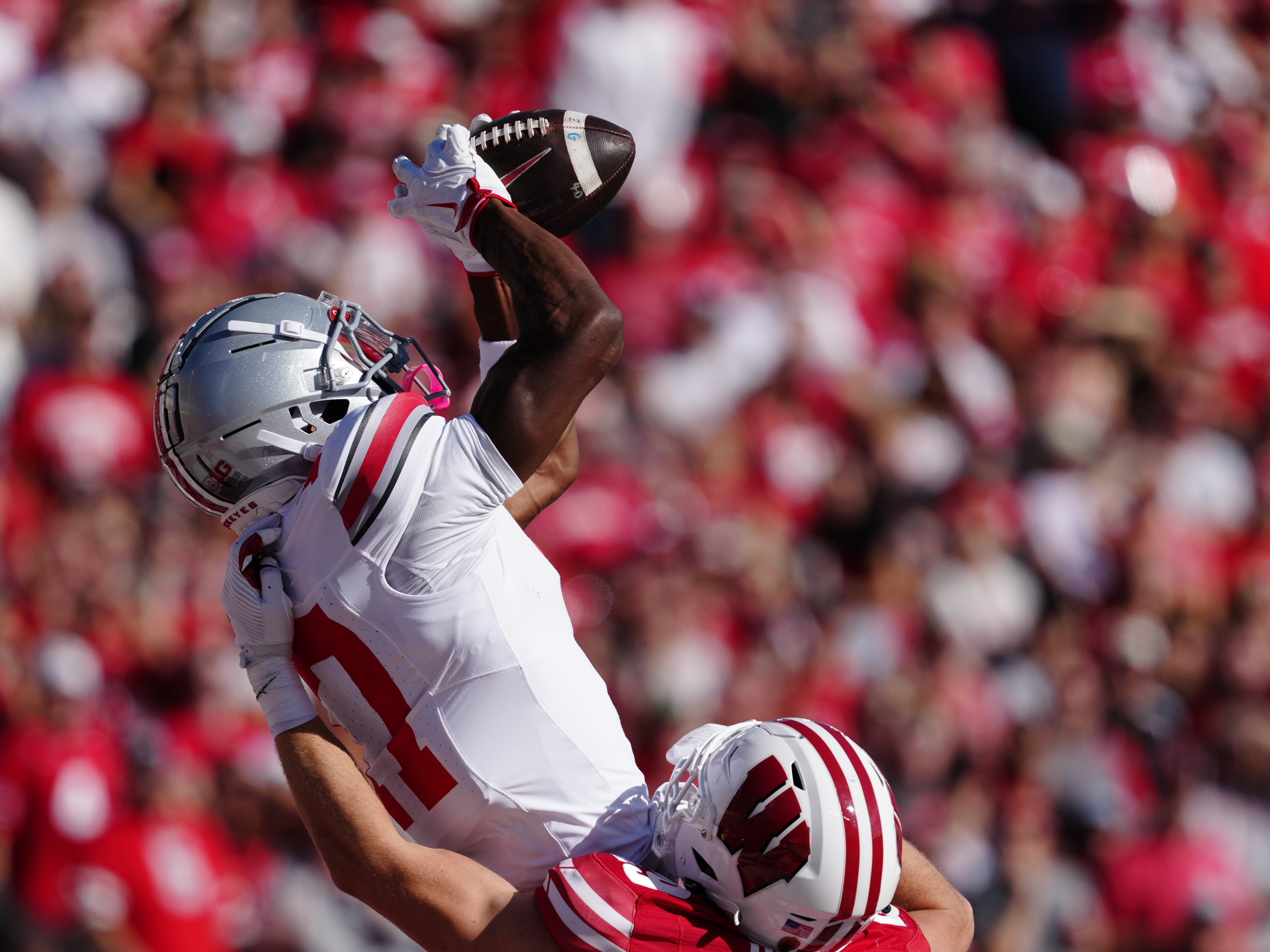 Oct 18, 2025; Madison, Wisconsin, USA; Ohio State Buckeyes wide receiver Carnell Tate (17) catches a touchdown pass in the first quarter agains the Wisconsin Badgers at Camp Randall Stadium on October 18, 2025 in Madison, Wisconsin. Photography by Ross Harried for Second Crop Sports.